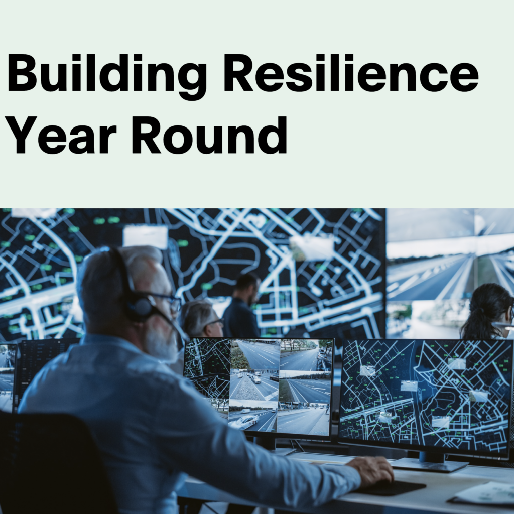 Building Resilience Year Round. Man sitting at desk.